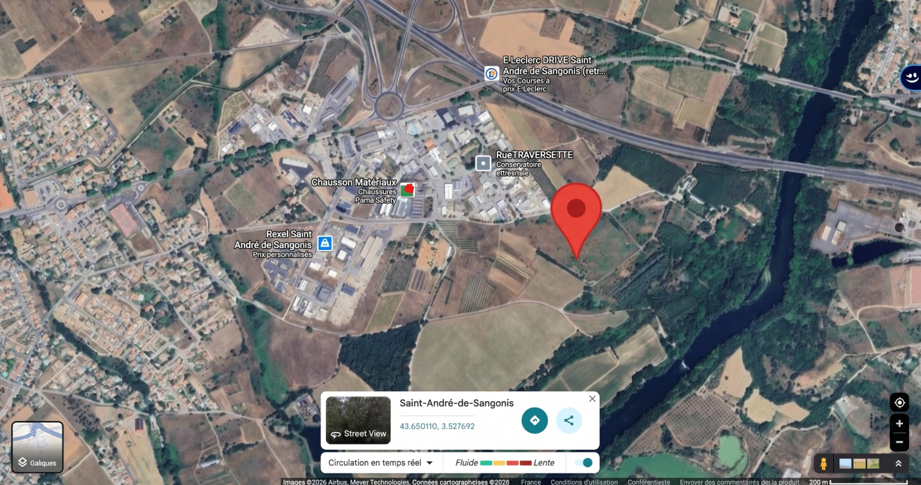 Vue satellite du secteur de Saint-André-de-Sangonis, zone d'activités et fleuve Hérault